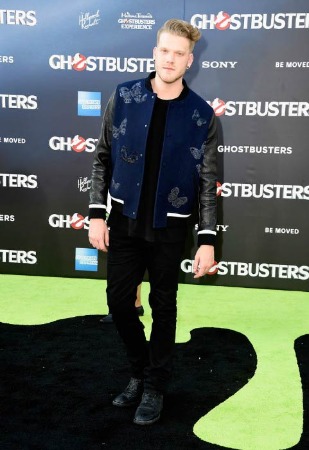 Photo of Scott Hoying wearing black leather jacket with black pants and boots 